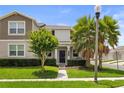 Charming two-story home featuring a well-maintained lawn and inviting landscaping, offering great curb appeal at 15096 Chapter Way, Winter Garden, FL 34787