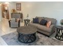 Cozy living room with neutral tones, comfortable seating, and a stylish rug for a welcoming atmosphere at 2426 Windward Way, Winter Park, FL 32792
