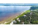 Picturesque aerial view of the property, highlighting its stunning waterfront location and lush landscape at 2518 Fort Lane Rd, Geneva, FL 32732