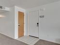 Bright condo entryway featuring tile flooring and coat rack near front door at 2729 N Poinciana Blvd # 125, Kissimmee, FL 34746