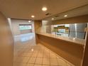 Open concept kitchen with a breakfast bar, white cabinets, and stainless-steel appliances at 510 Cranes Way # 302, Altamonte Springs, FL 32701