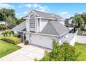 Charming home with a two-car garage, a well-maintained yard, and beautiful surrounding greenery at 754 Birgham Pl, Lake Mary, FL 32746