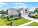 Charming two-story home with an attached two-car garage and beautifully maintained landscaping at 754 Birgham Pl, Lake Mary, FL 32746