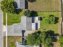 Aerial shot of the property, showcasing the layout, landscaping, and surrounding neighborhood at 7911 Murcott Cir, Orlando, FL 32835