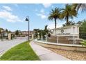 Community entrance with fountain, The Fountains sign, and meticulously landscaped grounds at 8219 Roseville Blvd, Davenport, FL 33896