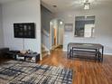 Open-concept living room and dining area with hardwood floors and neutral decor at 1022 Calabria Ave, Davenport, FL 33897