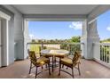 Balcony seating overlooking golf course; a perfect outdoor space for relaxing and enjoying views at 1100 Sunset View Cir # 204, Reunion, FL 34747