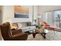 Comfortable living room with modern furniture, neutral color palette, and large windows at 2305 Edgewater Dr # 1613, Orlando, FL 32804