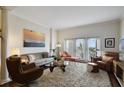 Spacious living room featuring modern furnishings, a plush rug, and bright natural light at 2305 Edgewater Dr # 1613, Orlando, FL 32804