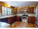 Traditional kitchen with stainless steel appliances, granite countertops, and custom cabinetry at 3443 S Mellonville Ave, Sanford, FL 32773