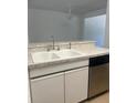 Kitchen sink including stainless steel dishwasher, white cabinets, and granite countertops at 460 Sand Lime Rd, Winter Garden, FL 34787