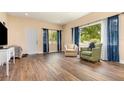 Inviting living room with hardwood floors, natural light and two comfortable armchairs at 660 6Th St, Daytona Beach, FL 32117