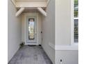 Inviting covered entryway featuring a decorative glass door at 1425 Lone Wood Blvd, Orlando, FL 32828