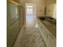Bathroom featuring a marble-topped vanity and a glass enclosed shower at 1486 Farrindon Cir, Lake Mary, FL 32746