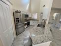 Kitchen featuring stainless steel appliances, granite countertops, and tile flooring at 1486 Farrindon Cir, Lake Mary, FL 32746
