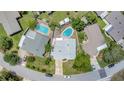 Aerial shot of a home showcasing a spacious backyard and proximity to nearby pools at 2835 Bongart Rd, Winter Park, FL 32792