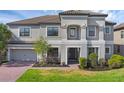 Charming two-story home boasting a covered entryway and a meticulously landscaped front yard at 2901 Agostino Ter, Kissimmee, FL 34746