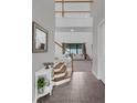 Bright foyer with a view into the living room and staircase, offering an inviting entrance at 2901 Agostino Ter, Kissimmee, FL 34746