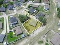 Aerial view highlighting property boundaries with the house situated on a well-maintained, grassy lot at 331 Erie Ct, Kissimmee, FL 34759