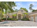 Stunning single story home with a driveway and lush landscaping at 3381 Regal Crest Dr, Longwood, FL 32779