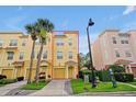 Charming three-story townhome with a one-car garage, and manicured landscaping at 4816 Tidecrest Ave # 178, Orlando, FL 32819