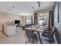 Open concept dining and living space with modern decor and abundant natural light at 4834 Lullaby Ln, Kissimmee, FL 34746
