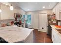 Updated kitchen features modern appliances, white cabinetry, and ample counter space at 5032 Timber Ridge Trl, Ocoee, FL 34761