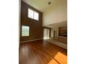 Bright living room featuring hardwood floors, high ceilings, and natural light at 6024 Chapledale Dr, Orlando, FL 32829