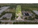 Expansive aerial view showcasing the property's boundaries and surrounding greenery at 6957 Plymouth Sorrento Rd, Apopka, FL 32712