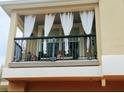 Relaxing balcony that includes seating and curtains at 725 Ashworth Overlook Dr # C, Apopka, FL 32712