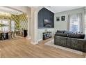 Bright and spacious living room featuring stylish decor and hardwood floors at 11721 Camden Park Dr, Windermere, FL 34786