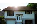 Two-story home featuring a sunny exterior and well-maintained landscaping at 238 Lake Dr, Orlando, FL 32835