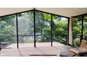 Relaxing screened porch with comfortable seating and beautiful views of the surrounding greenery at 238 Lake Dr, Orlando, FL 32835