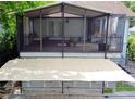Spacious screened porch with ample seating, perfect for enjoying the outdoors in comfort at 238 Lake Dr, Orlando, FL 32835