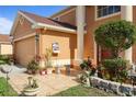 A close-up view of the front of the home, showcasing its architectural details, landscaping, and entrance at 314 Edgewood Ct, Kissimmee, FL 34759