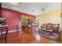 Cozy living room featuring stylish furniture, hardwood floors, and an open layout, great for entertaining at 314 Edgewood Ct, Kissimmee, FL 34759