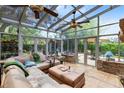 Bright sunroom filled with natural light and a comfortable seating area at 556 Lake Ave, Altamonte Springs, FL 32701