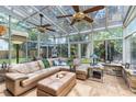 Bright sunroom filled with natural light and a comfortable seating area at 556 Lake Ave, Altamonte Springs, FL 32701