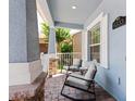 Inviting porch with comfortable seating, perfect for relaxing and enjoying the neighborhood views at 6333 Schoolhouse Pond Rd, Winter Garden, FL 34787