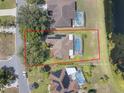 Aerial view showcasing property lines, pool, and proximity to neighborhood amenities at 703 Sunridge Woods Blvd, Davenport, FL 33837