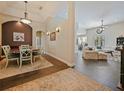 Open-concept home featuring tile flooring, a dining room, and an open living room at 809 Palmetto Ter, Oviedo, FL 32765
