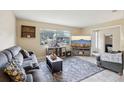 Cozy living room with large window, neutral colors, and comfortable seating arrangement at 8652 Savory Dr, Orlando, FL 32825