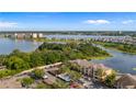 Aerial view of lakeside apartments with dedicated parking and lush surrounding greenery at 8801 Latrec Ave # 8107, Orlando, FL 32819