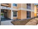Exterior view of the apartment building showcasing stucco siding and balcony at 8801 Latrec Ave # 8107, Orlando, FL 32819