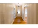 Hallway with a gleaming hardwood floor and natural light throughout at 911 S Oak Ave, Sanford, FL 32771