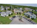 Scenic aerial view of the townhome community, highlighting lush landscaping and water features at 105 Wood Duck Cir # D, Daytona Beach, FL 32119
