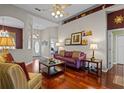 Comfortable living room with archways, wood floors, and tasteful decor for relaxed living at 12207 Shadowbrook Ln, Orlando, FL 32828