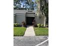 Condo with well-maintained landscaping and inviting walkway to front door at 124 Springwood Cir # B, Longwood, FL 32750