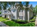 Charming townhome with well-maintained lawn and mature landscaping at 1300 Eastern Pecan Pl # 104, Winter Garden, FL 34787