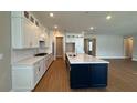 Spacious kitchen with modern cabinetry, countertops, and a large center island at 15569 Orchid Rose Ct, Winter Garden, FL 34787